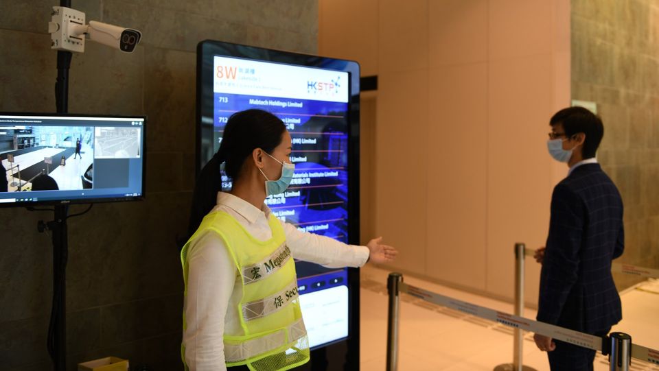 Young female officer duty at a temperature screening post